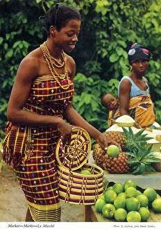 Africa - Woman buying limes at an African market