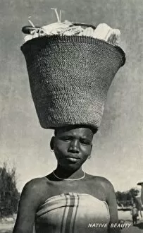 Maize Collection: Africa woman carrying maize on her head