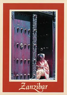Woodwork Prints: Africa - Zanzibar - Girl in ornately-carved wooden doorway