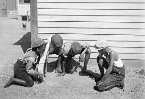 African American Gallery: Four African American children playing a gambling game in Am
