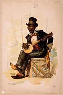 African American in tuxedo and top hat, seated, playing banj
