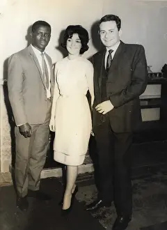 Consulate Prints: African man, English lady and man at an event at British Con