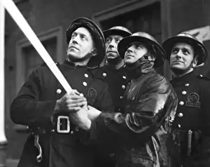 Hosepipes Prints: Four AFS firefighters operating hosepipe, WW2