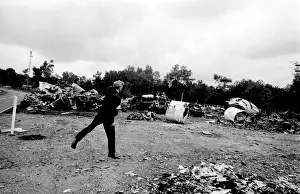 Air crash investigator examining debris