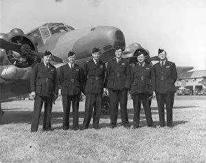 Air Transport Auxiliary pilots in front of an Avro Anson
