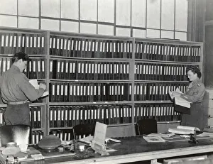 An Airman and Woman in the Office of the Headquarters of?