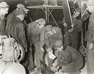 Erding Prints: Airmen Maintaining Components at the Headquarters of the?