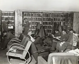 Erding Prints: Airmen Reading Books and Magazines in the Library of the?