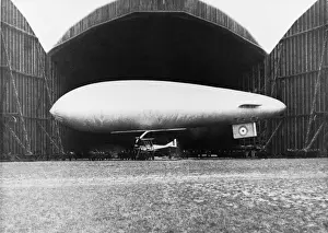 Airship with Biplane Fighter Aircraft Hanging Underneath