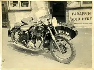 AJS / A J Stevens British Motorcycle & Sidecar at a Garage, En