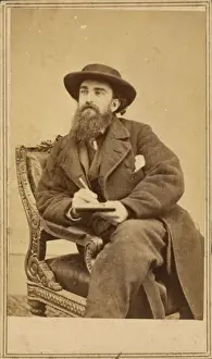 Alfred Waud, full-length portrait, seated, holding a pencil