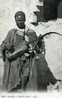 Guitar Prints: Algeria - African Gnawa Musician playing a traditional sintir