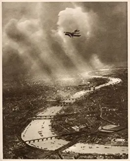 Amazing aerial photograph looking east over London, in the farthest distance the river