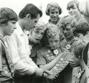 American Scouts looking at badges