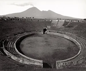 Vesuvius Prints: Amphitheatre at Pompeii with Mount Vesuvius in background