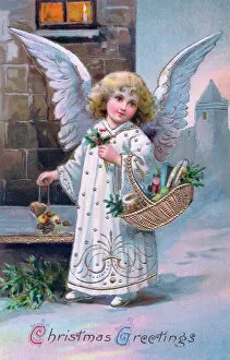 Angel with basket of gifts on a Christmas postcard