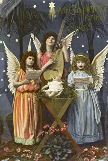Nativity Gallery: Three angels sing around crib - Kitsch Christmas postcard