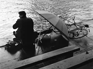 Solitary Prints: Angling in the Rain