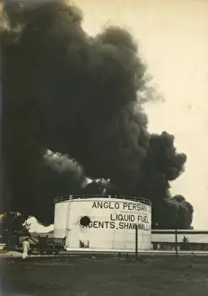 Shelled Prints: Anglo-Persian Oil fuel tanks burning in Madras
