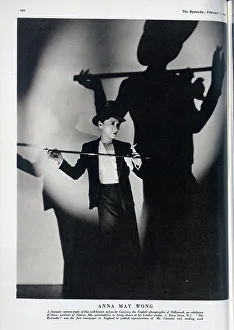 Cannons Prints: Anna May Wong, actress, studio portrait with top hat and cane