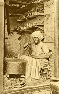 Arab cobbler at work in his shop, Cairo, Egypt