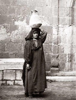 New Images May Collection: Arab peasant woman carrying water, Egypt, circa 1880. Date: circa 1880