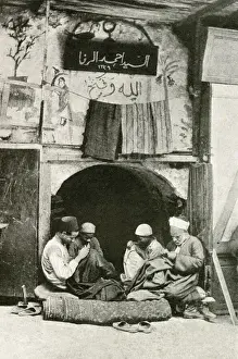 Arab tailor and assistants at work in a shop, Cairo, Egypt