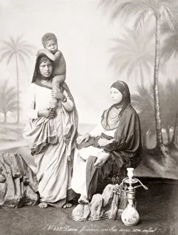 Two arab women with child, hookah pipe, Egypt, c. 1890
