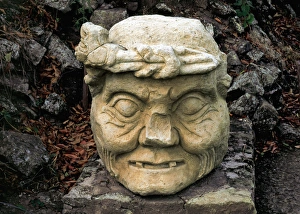 Archaeological Site of Copan. Stone head of an old man. Hond Archaeological Site of Copan. Stone head of an old man. Hond