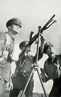 Preparations Prints: Army recruit learns to fire machine gun, WW2 preparations