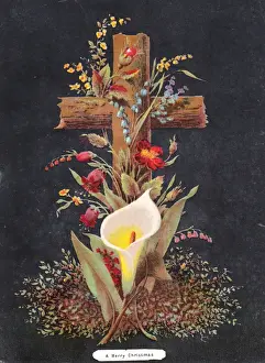 Arrangement of flowers around a cross on a Christmas card