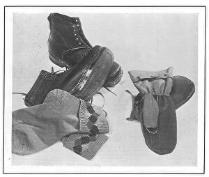 Waterproof Collection: An array of walking boots, knitted socks and waterproof mittens, from Gamages Date: 1930