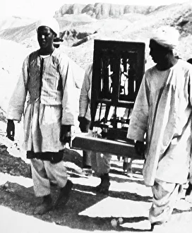 Artifacts being removed from the tomb of Tutankhamen