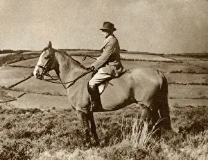 The artist, Alfred Munnings, riding a horse in Somerset