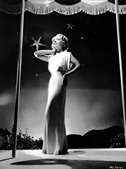 An attractive dress designed by Dolly Tree for Madge Evans