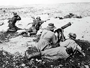 Australian soldiers firing a machine gun during WWI