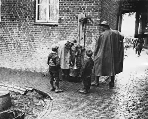Cobble Stones Prints: Australian soldiers at village pump, Fleurbaix, France, WW1