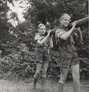 Lifting Prints: Two Austrian boy scouts lifting a pole