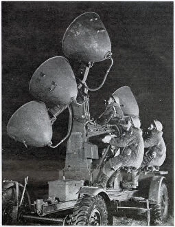 Territorial Collection: Auxiliary Territorial Service using search lights at night to spot on coming aircraft. Date: 1943