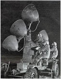 Territorial Collection: Auxiliary Territorial Service using search lights at night to spot on coming aircraft. Date: 1943