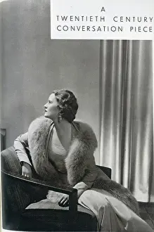 Crepe Prints: Averil Streatfield (1911-1977) is here seen modelling a crepe romain gown and a coat bordered with grey fox