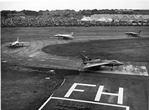 707s Prints: Four Avro 707s taxi past the crowd