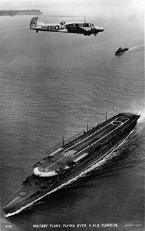 Avro Anson I K6206 flying over HMS Furious