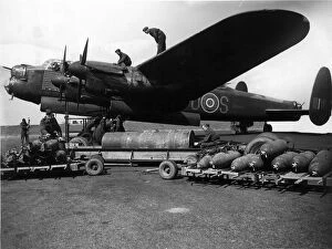 Avro Collection: Avro Lancaster I R5868s for Sugar being bombed up