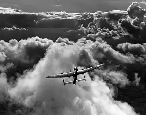 Avro Lancaster II flying above cloud