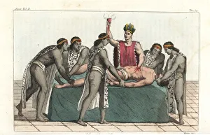 An Aztec priest removes a man's heart in a human sacrifice An Aztec priest removes a man's heart in a human sacrifice