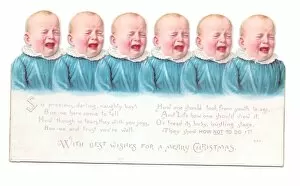 Six babies in blue on a cutout Christmas card