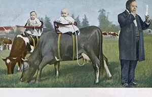 Two Babies getting their milk direct from the cow