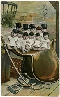 Images Dated 17th June 2016: Babies in hats, sitting on a large saddle