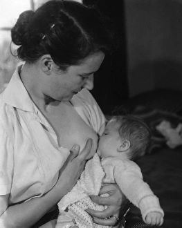 Images Dated 13th March 2012: Baby being Breastfed
